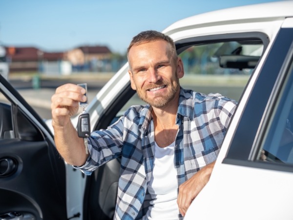 Man Holding a Car Key