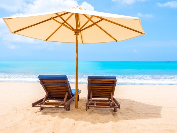 Sun Loungers and Umbrella on a Beach