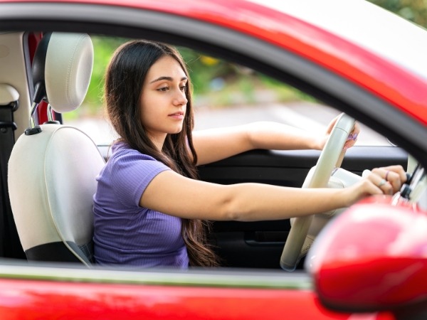 Young Woman Driving a Car