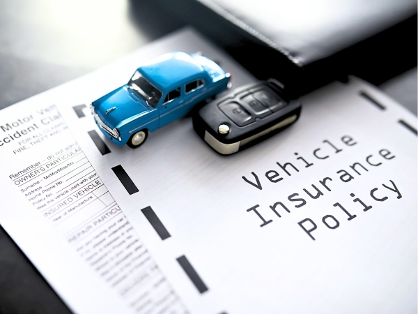 Miniature Car with Insurance Policy