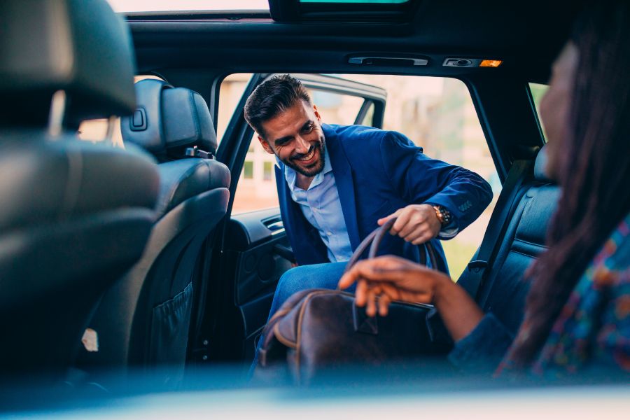 Woman Entering Rental Car at the Airport