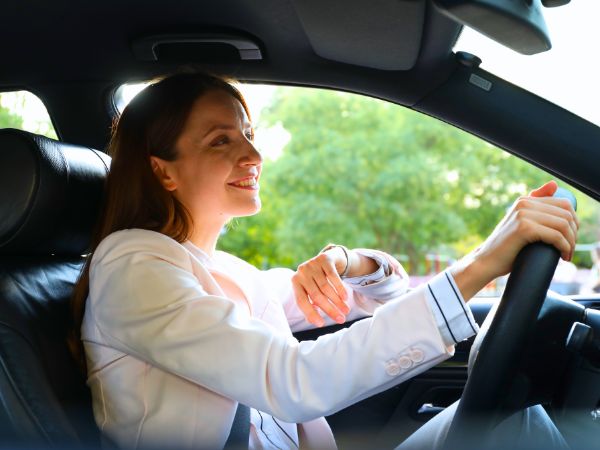 Woman driving her rental car